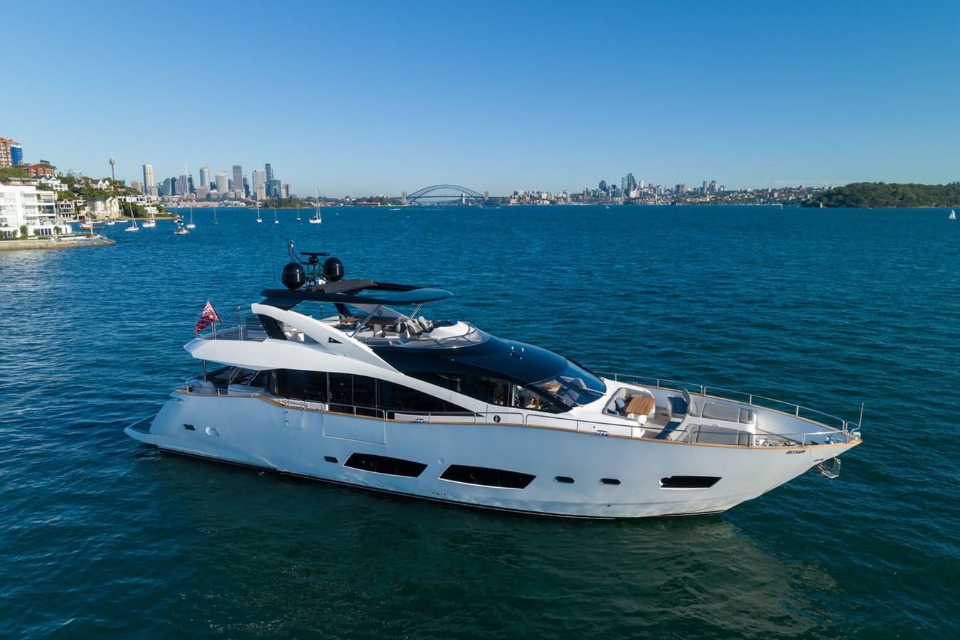 a white yacht in the water aboard ULTRAVIOLET Yacht for Sale