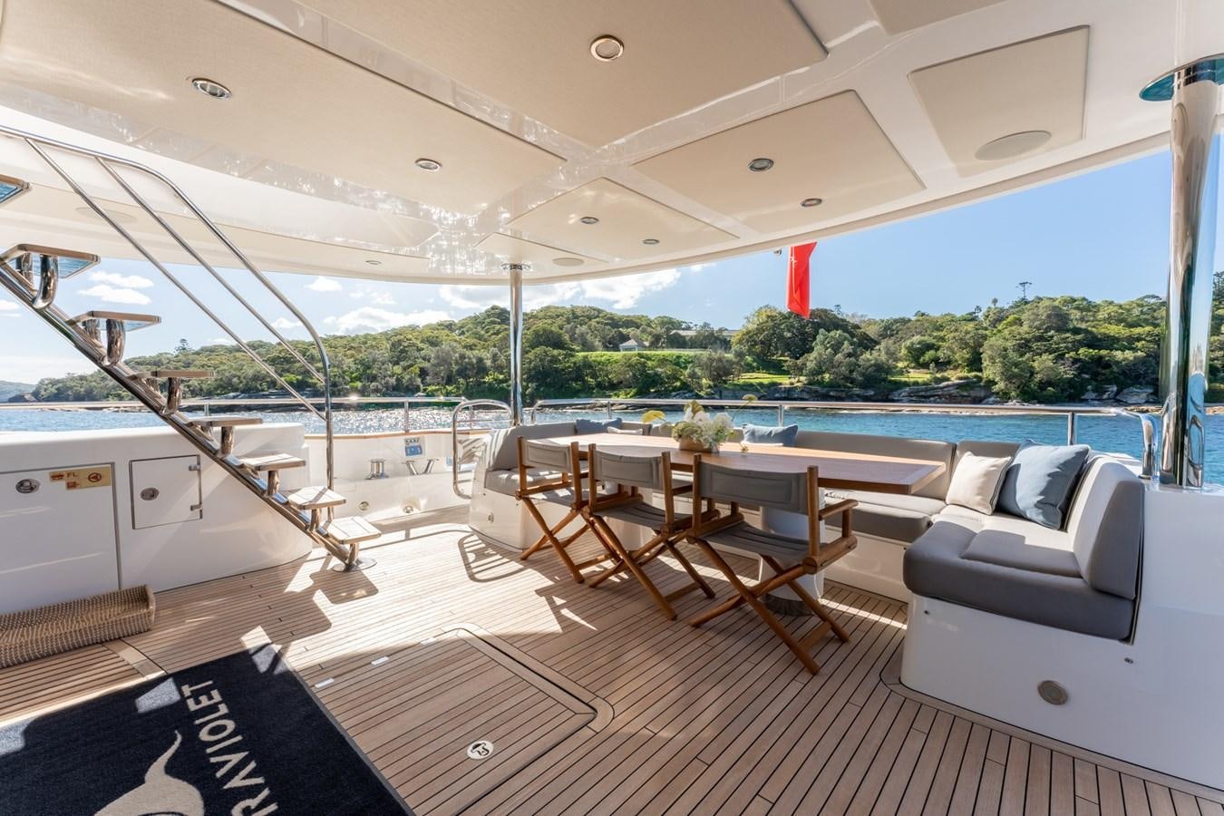 a room with a table and chairs aboard ULTRAVIOLET Yacht for Sale