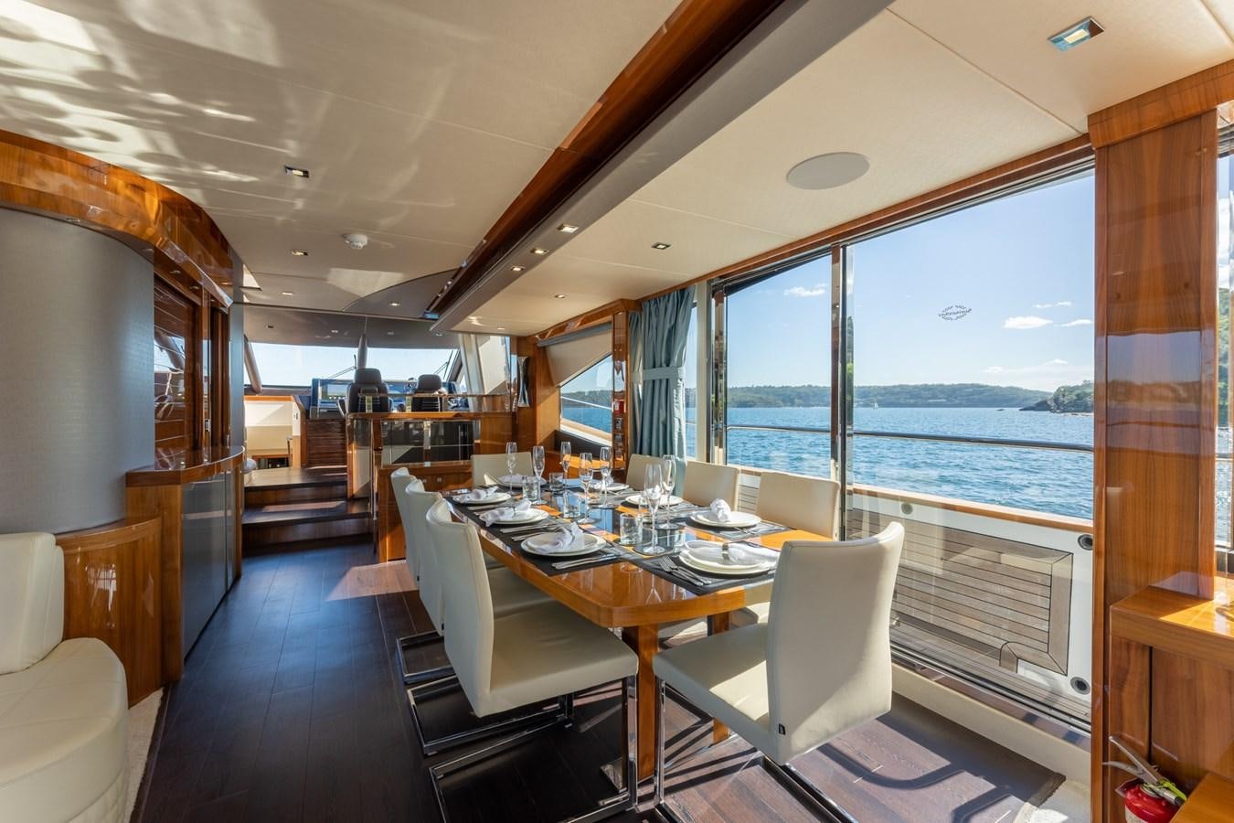 a dining table on a boat aboard ULTRAVIOLET Yacht for Sale