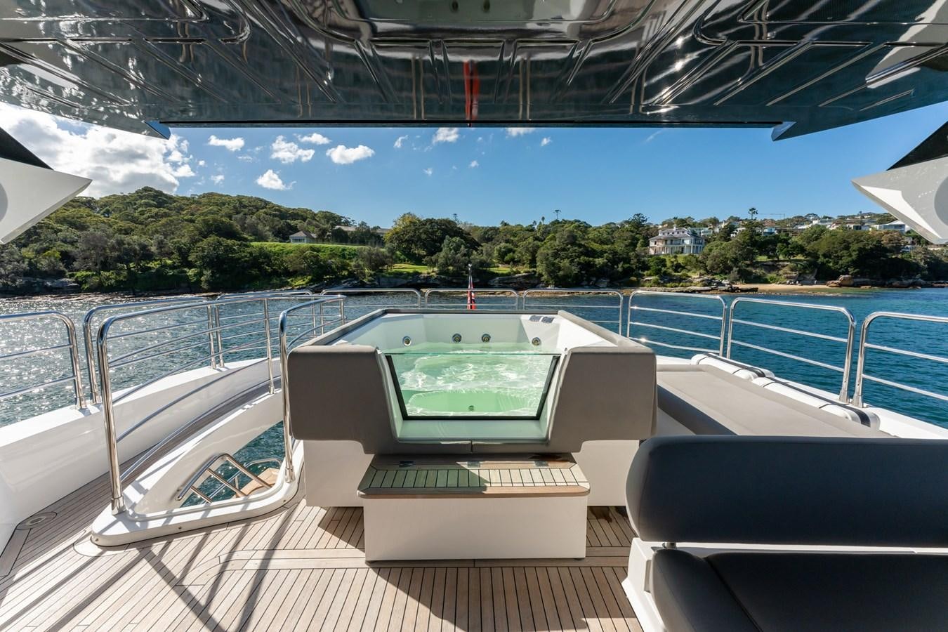 a laptop on a table aboard ULTRAVIOLET Yacht for Sale