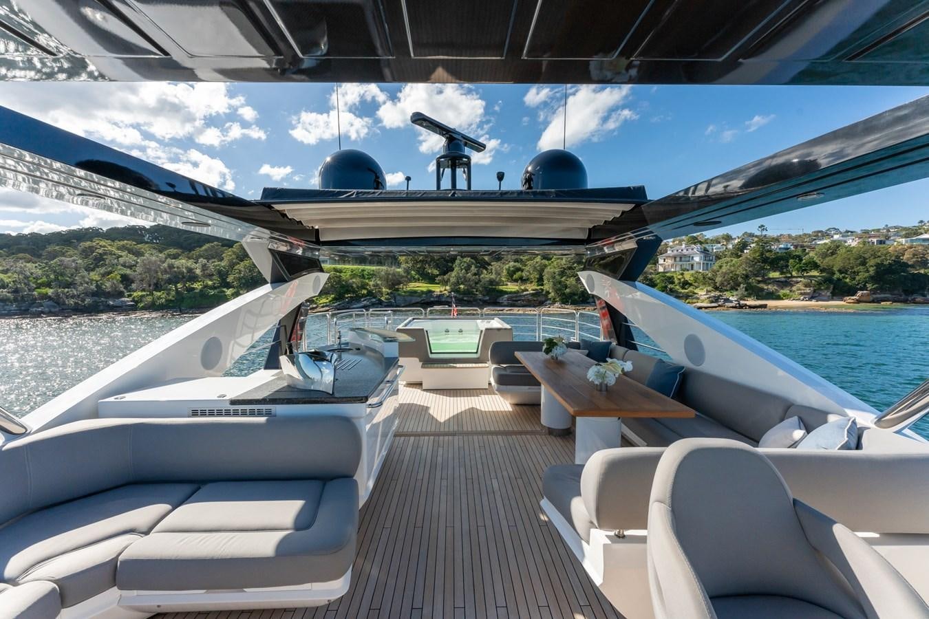 a deck with a deck and chairs on it aboard ULTRAVIOLET Yacht for Sale