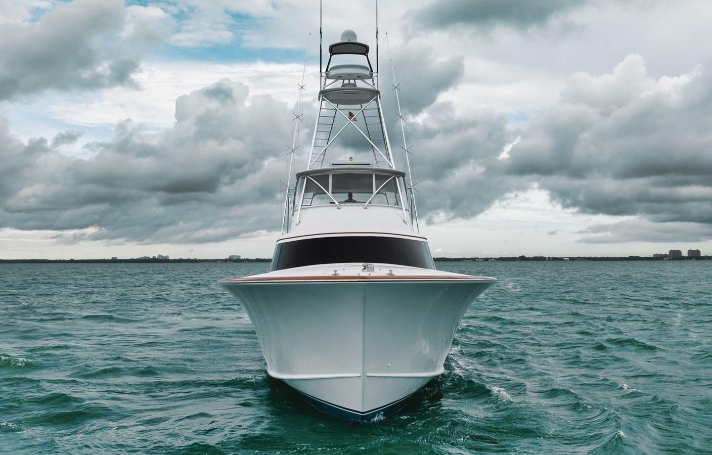 a white boat in the water aboard FULL TIME Yacht for Sale