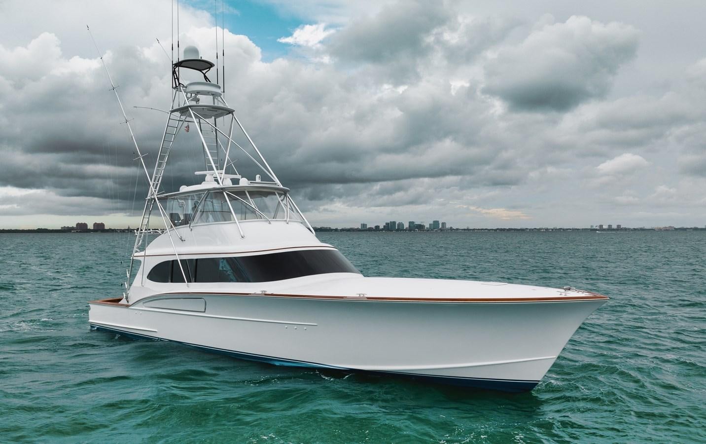 a white boat in the water aboard FULL TIME Yacht for Sale