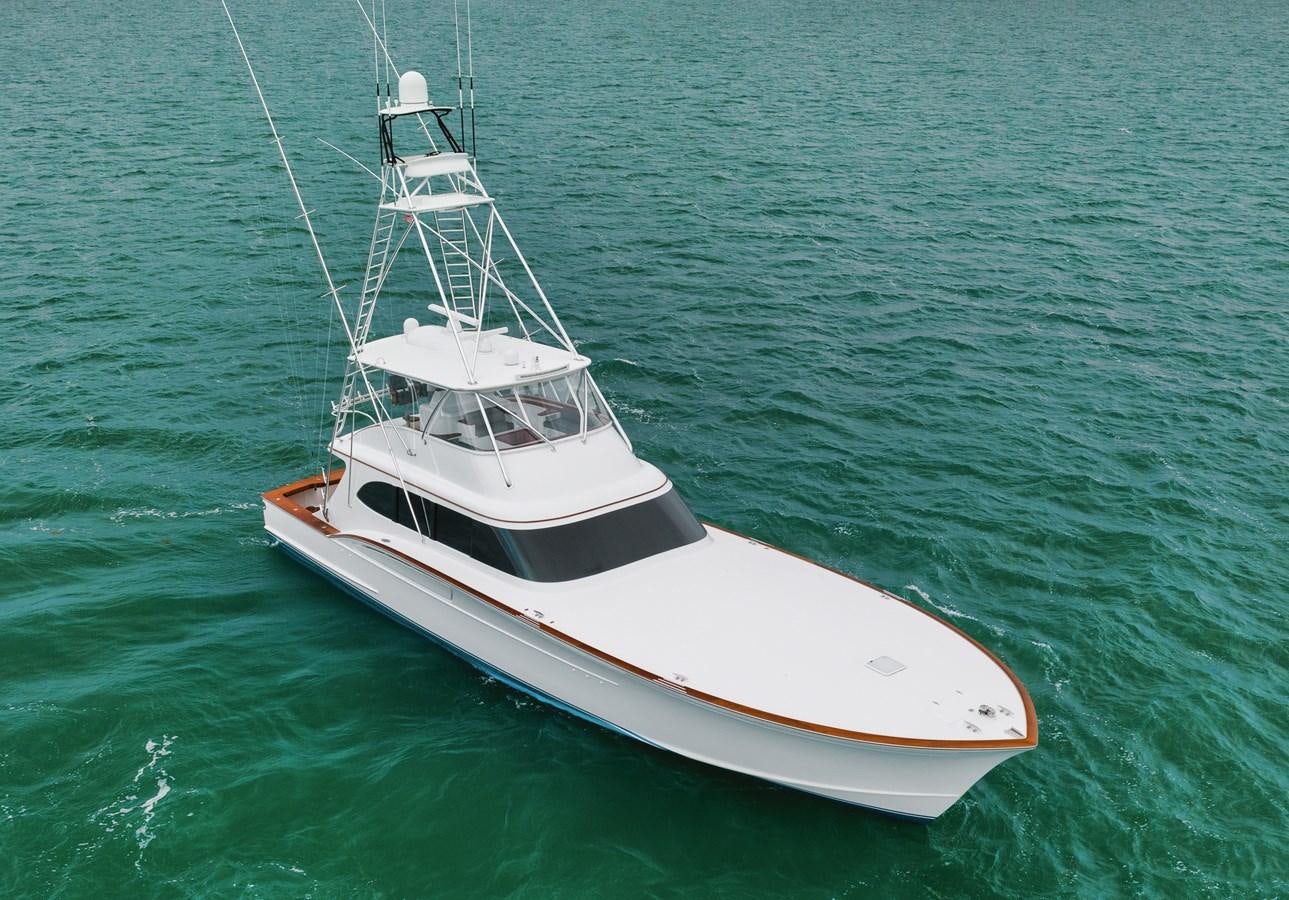 a white boat in the water aboard FULL TIME Yacht for Sale