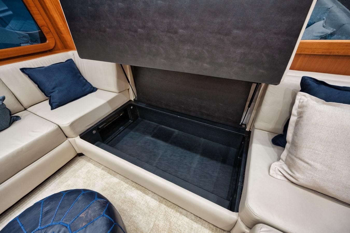 a car with a large window aboard FULL TIME Yacht for Sale