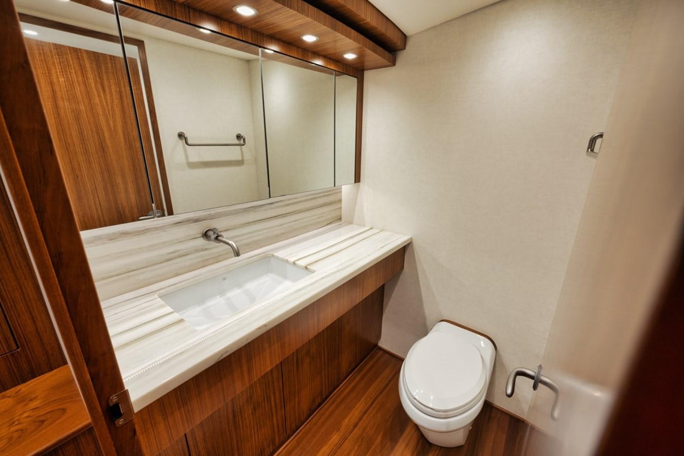 a bathroom with a sink and a toilet aboard FULL TIME Yacht for Sale