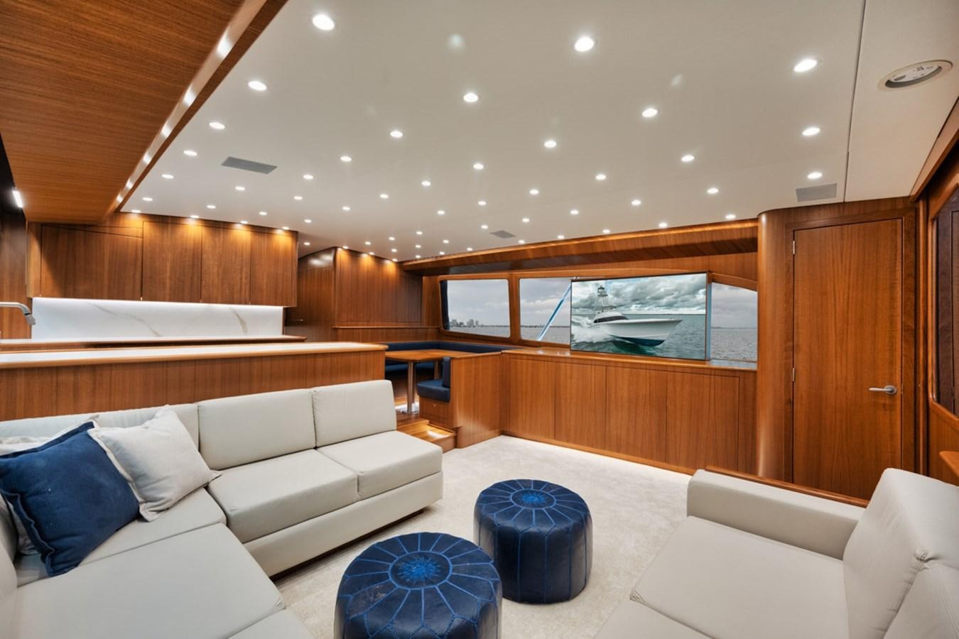 a room with a couch and a table aboard FULL TIME Yacht for Sale