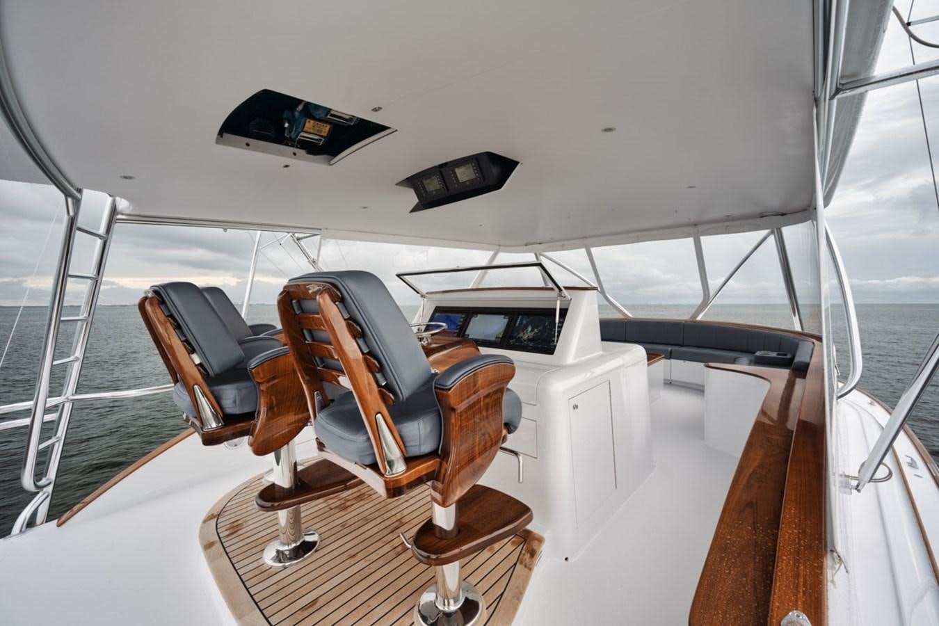 a white room with a desk and computer aboard FULL TIME Yacht for Sale