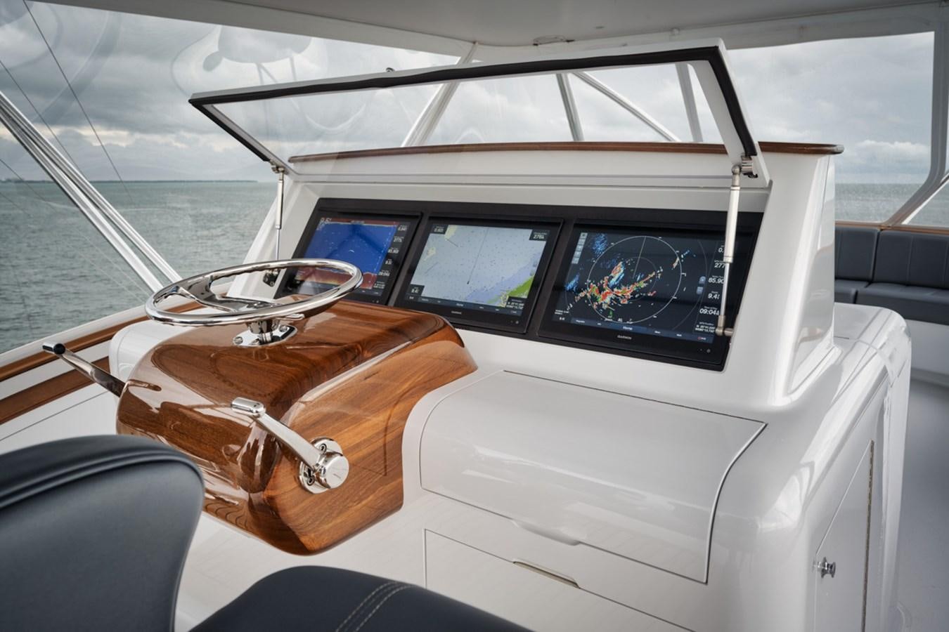a boat with a leather seat aboard FULL TIME Yacht for Sale