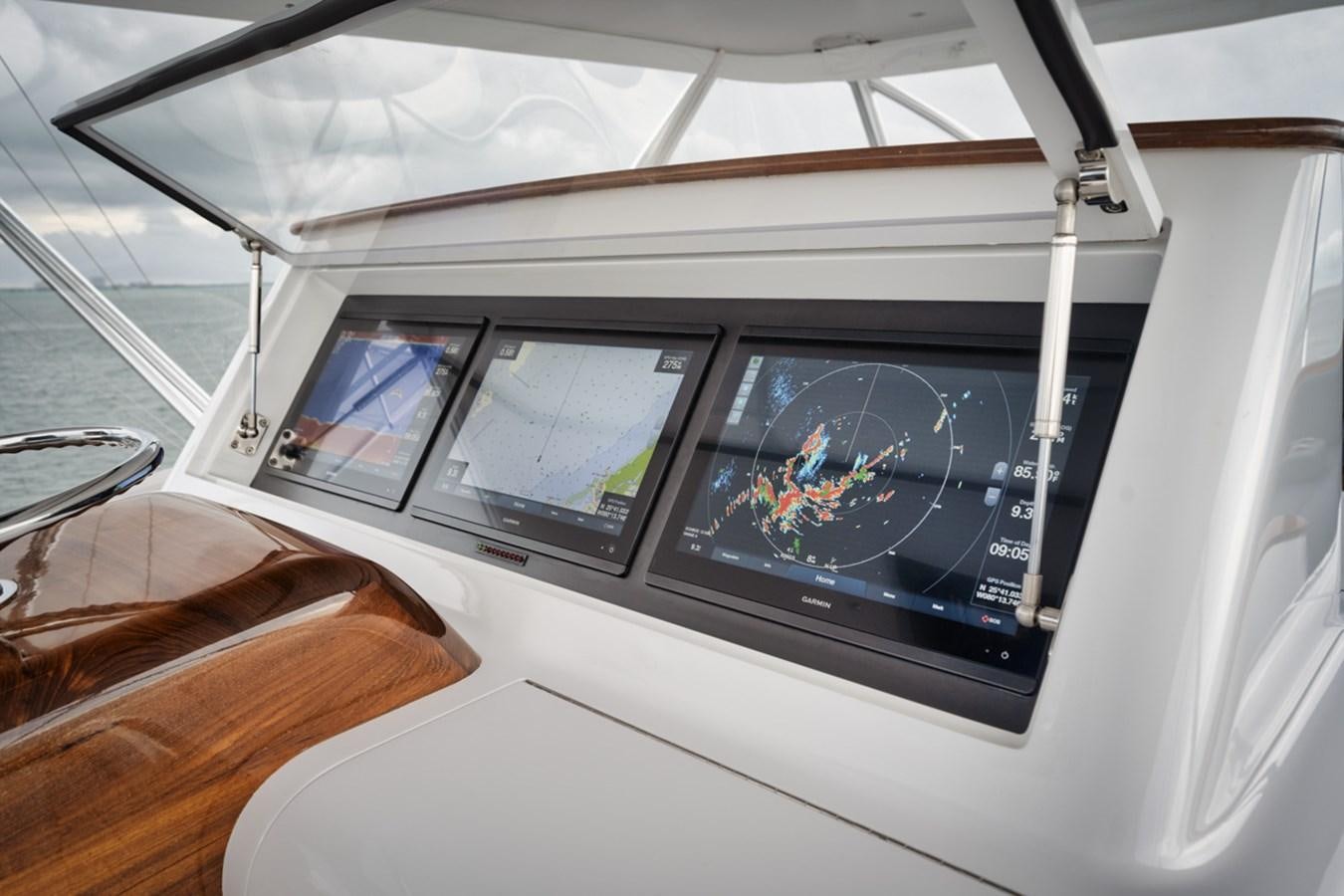 inside of a white car aboard FULL TIME Yacht for Sale