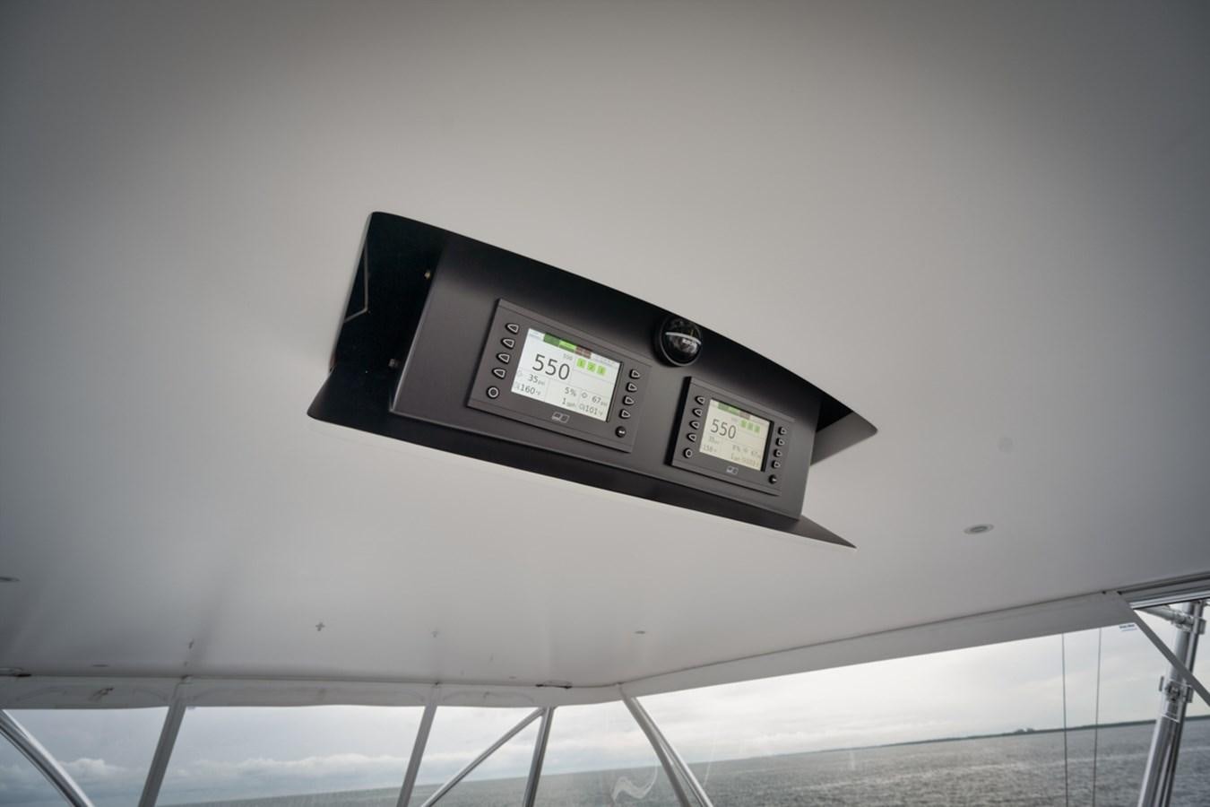 a rectangular electronic device on a white wall aboard FULL TIME Yacht for Sale