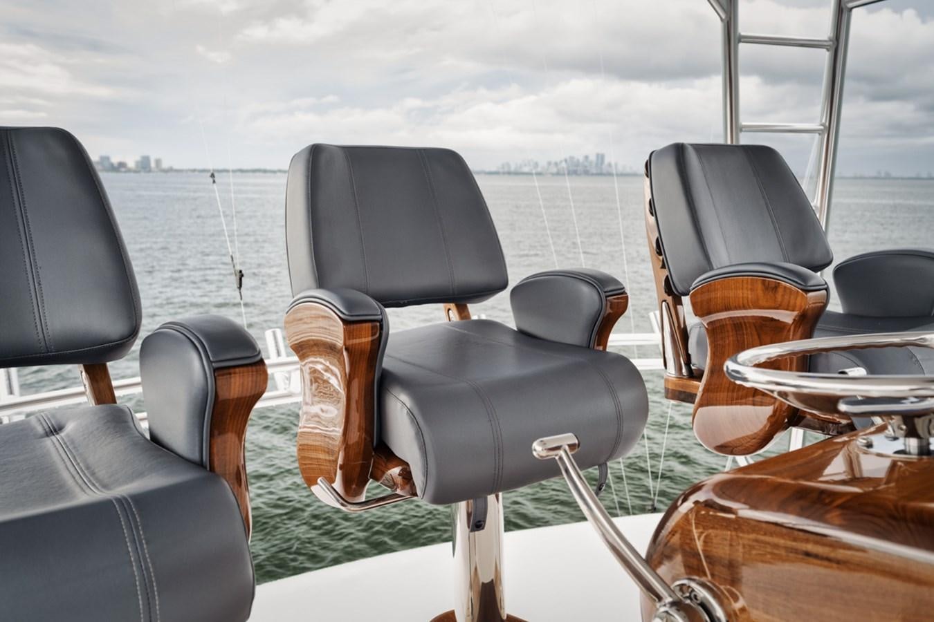 a group of chairs on a boat aboard FULL TIME Yacht for Sale