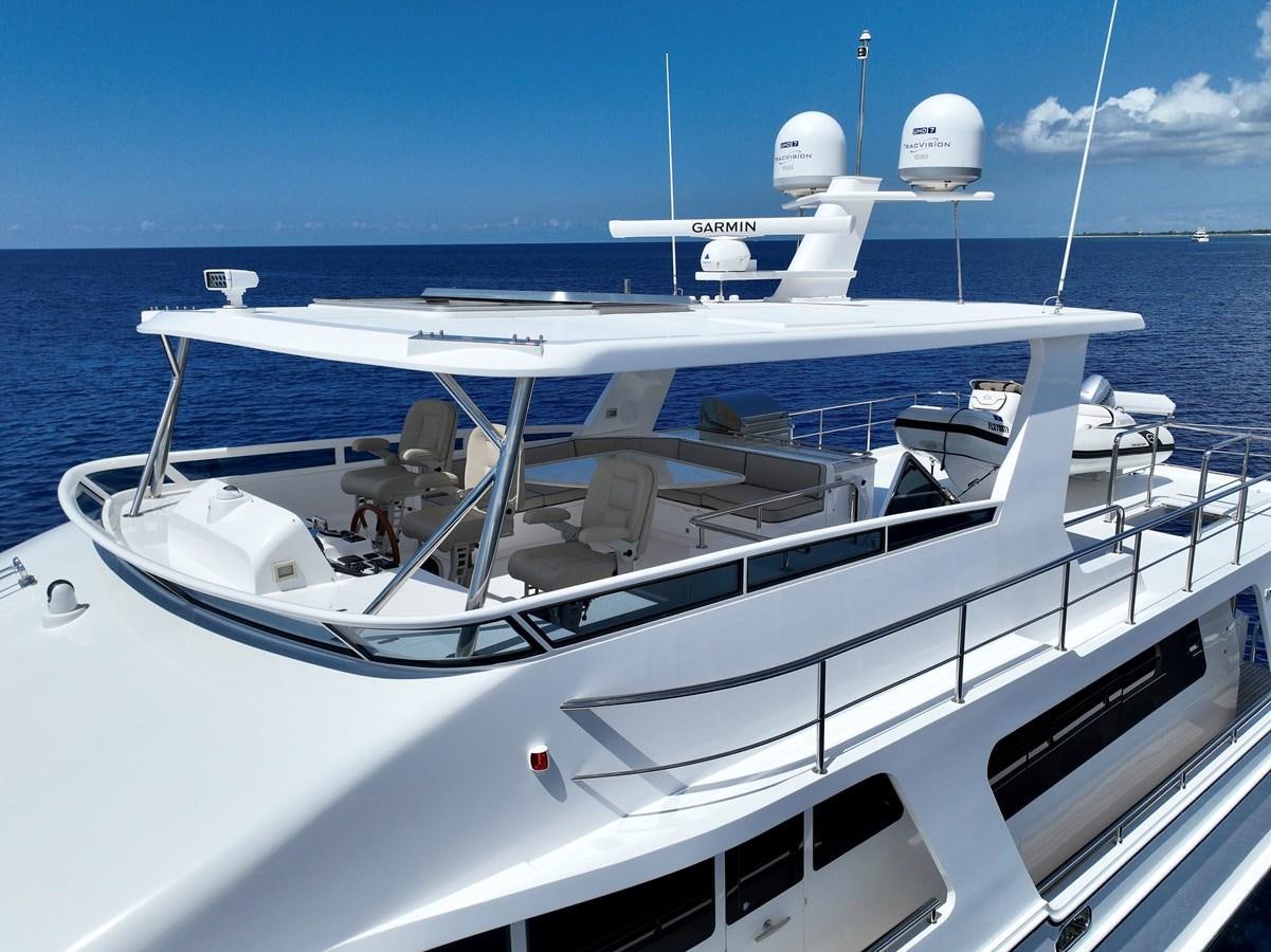 a white boat with a white front aboard KNOT FLYING Yacht for Sale