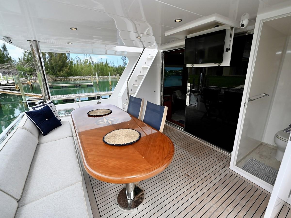 a table and chairs in a room aboard KNOT FLYING Yacht for Sale
