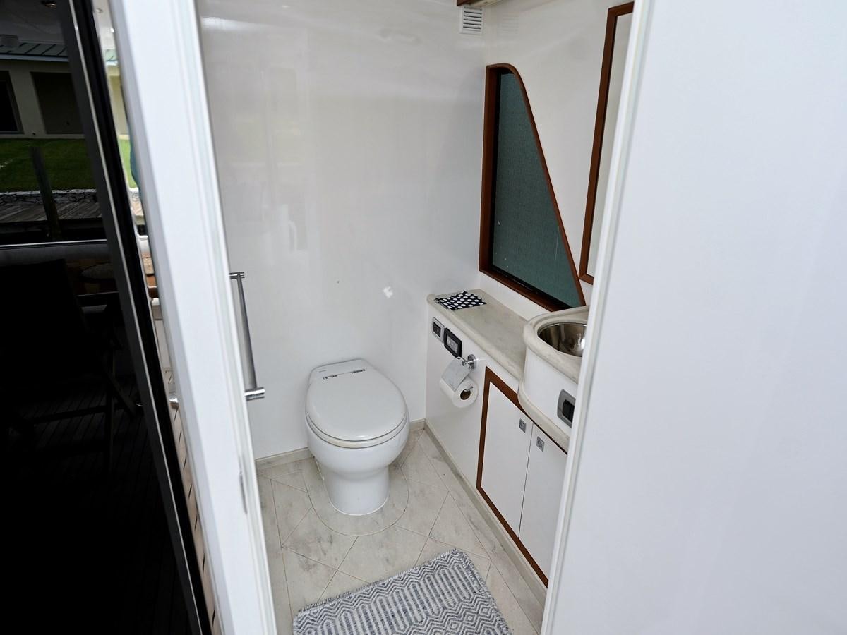 a small bathroom with a toilet aboard KNOT FLYING Yacht for Sale
