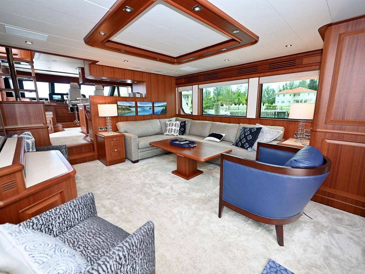 a living room with a large wood ceiling aboard KNOT FLYING Yacht for Sale