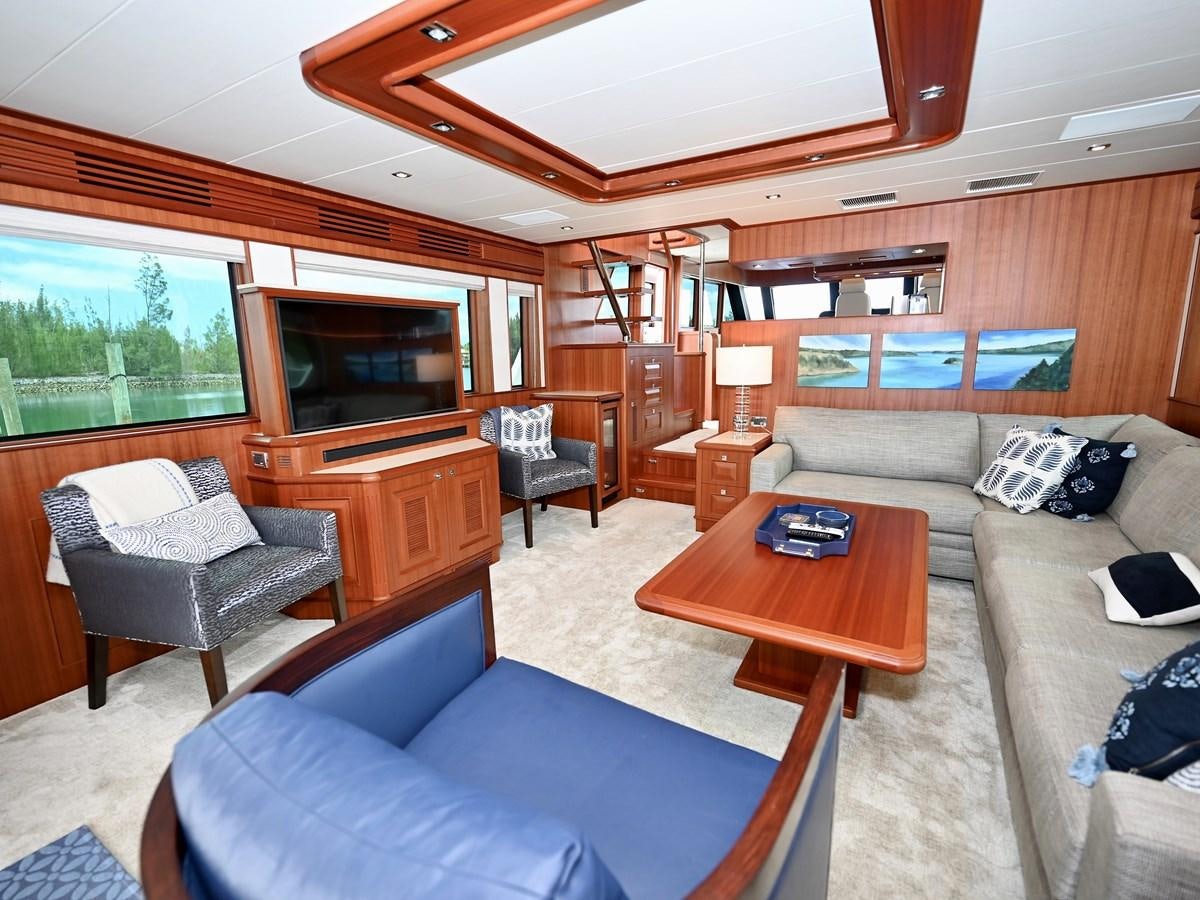 a living room with a couch and a coffee table aboard KNOT FLYING Yacht for Sale