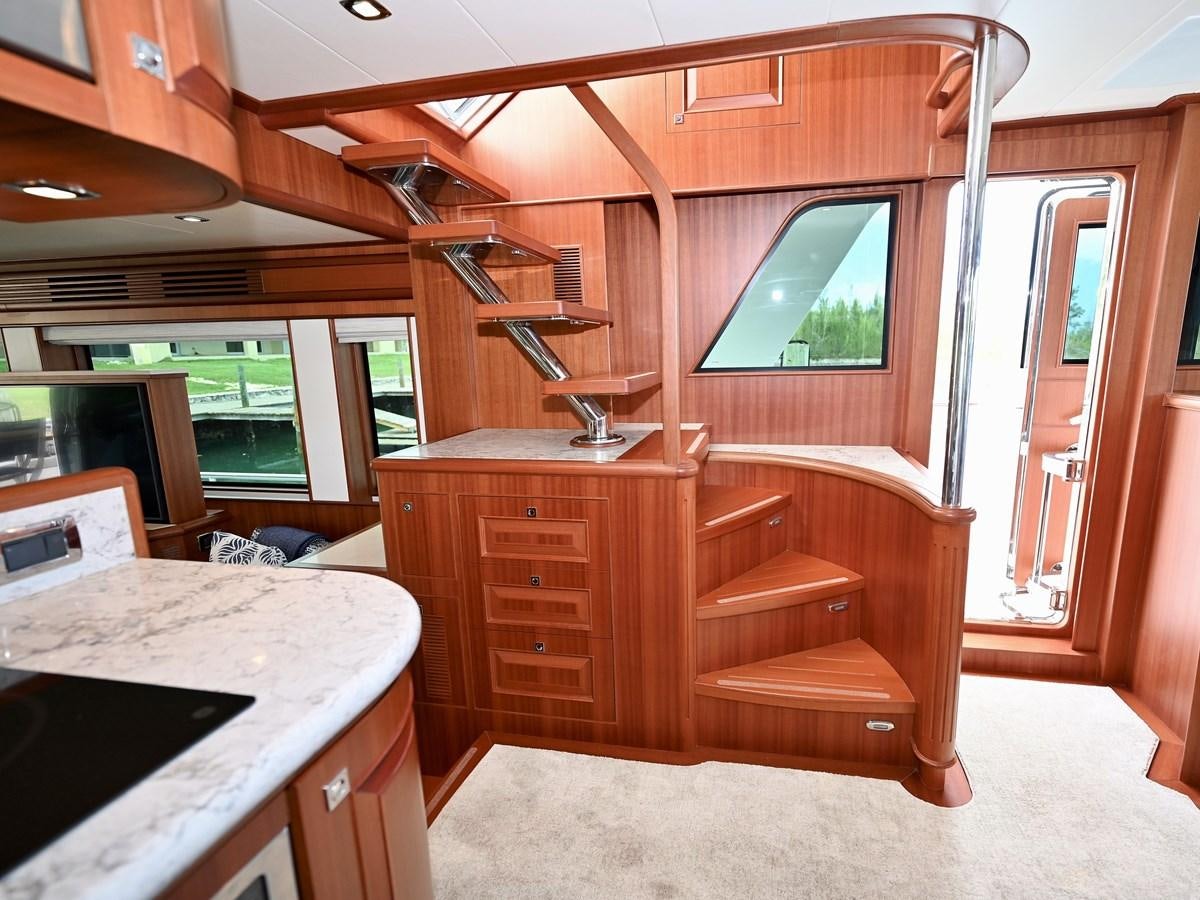 a room with a desk and a bed aboard KNOT FLYING Yacht for Sale