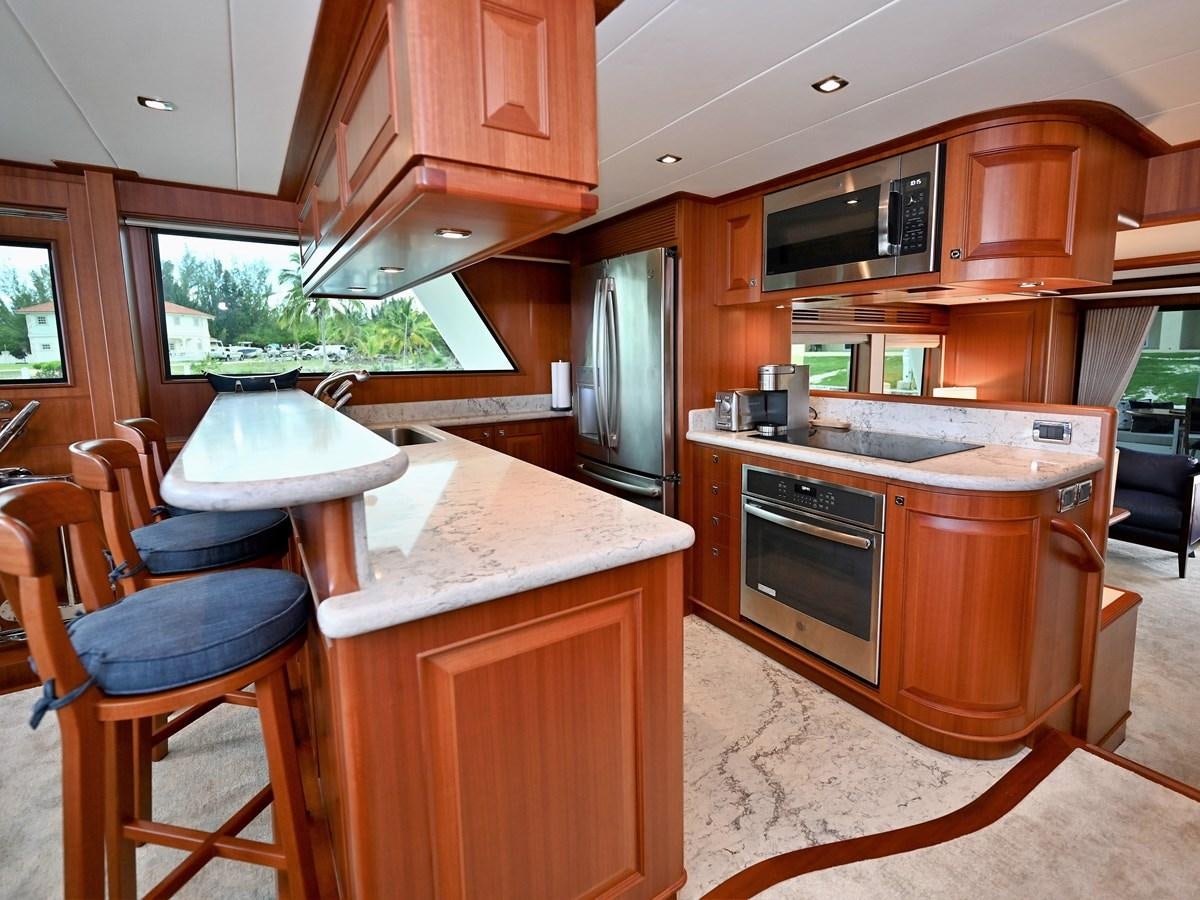 a kitchen with a table and chairs aboard KNOT FLYING Yacht for Sale
