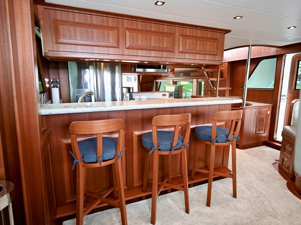 a kitchen with wooden cabinets aboard KNOT FLYING Yacht for Sale