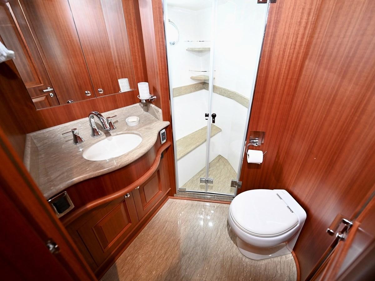 a bathroom with a sink toilet and a shower aboard KNOT FLYING Yacht for Sale