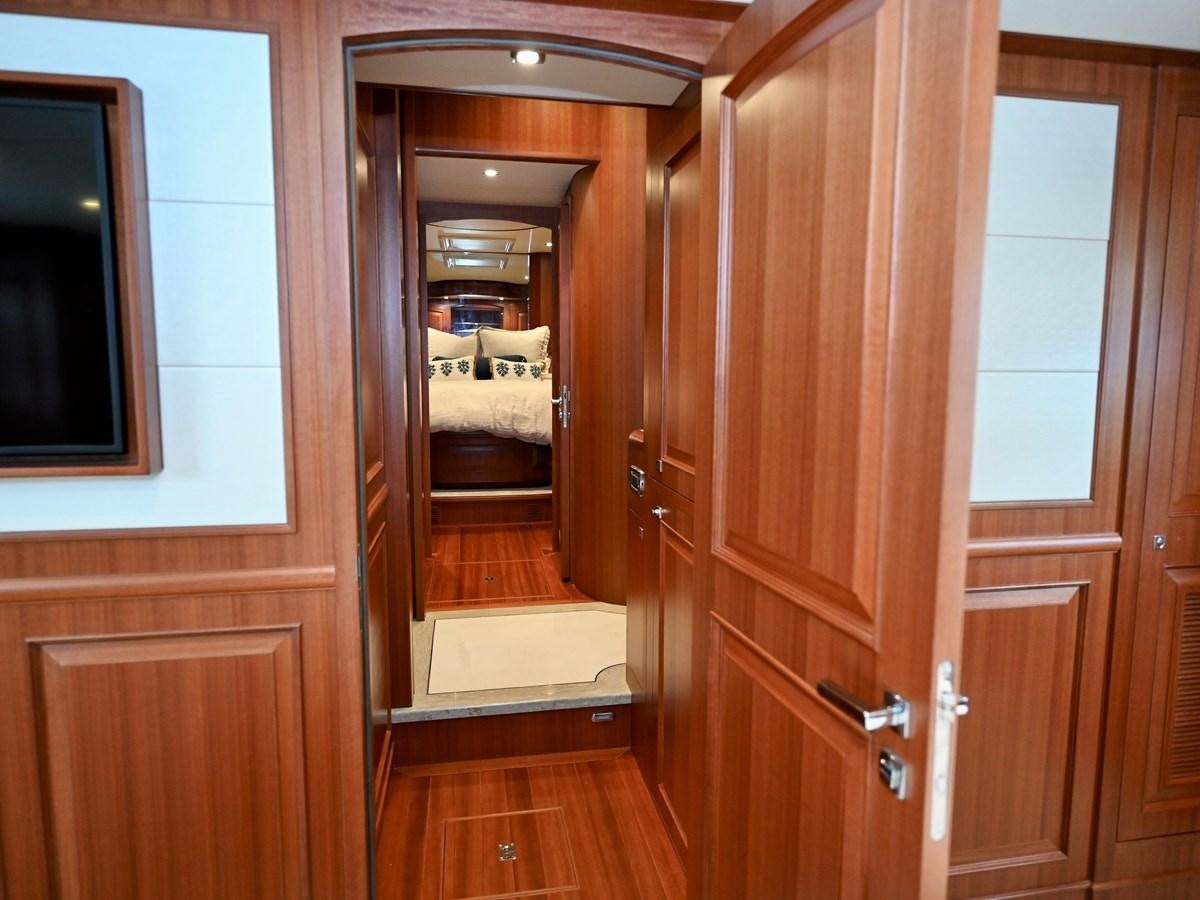 a room with a bed and a mirror aboard KNOT FLYING Yacht for Sale
