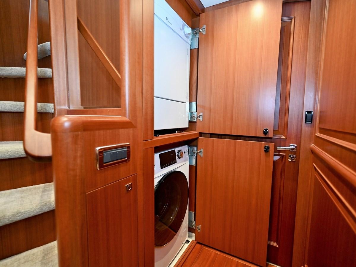 a room with wooden cabinets aboard KNOT FLYING Yacht for Sale