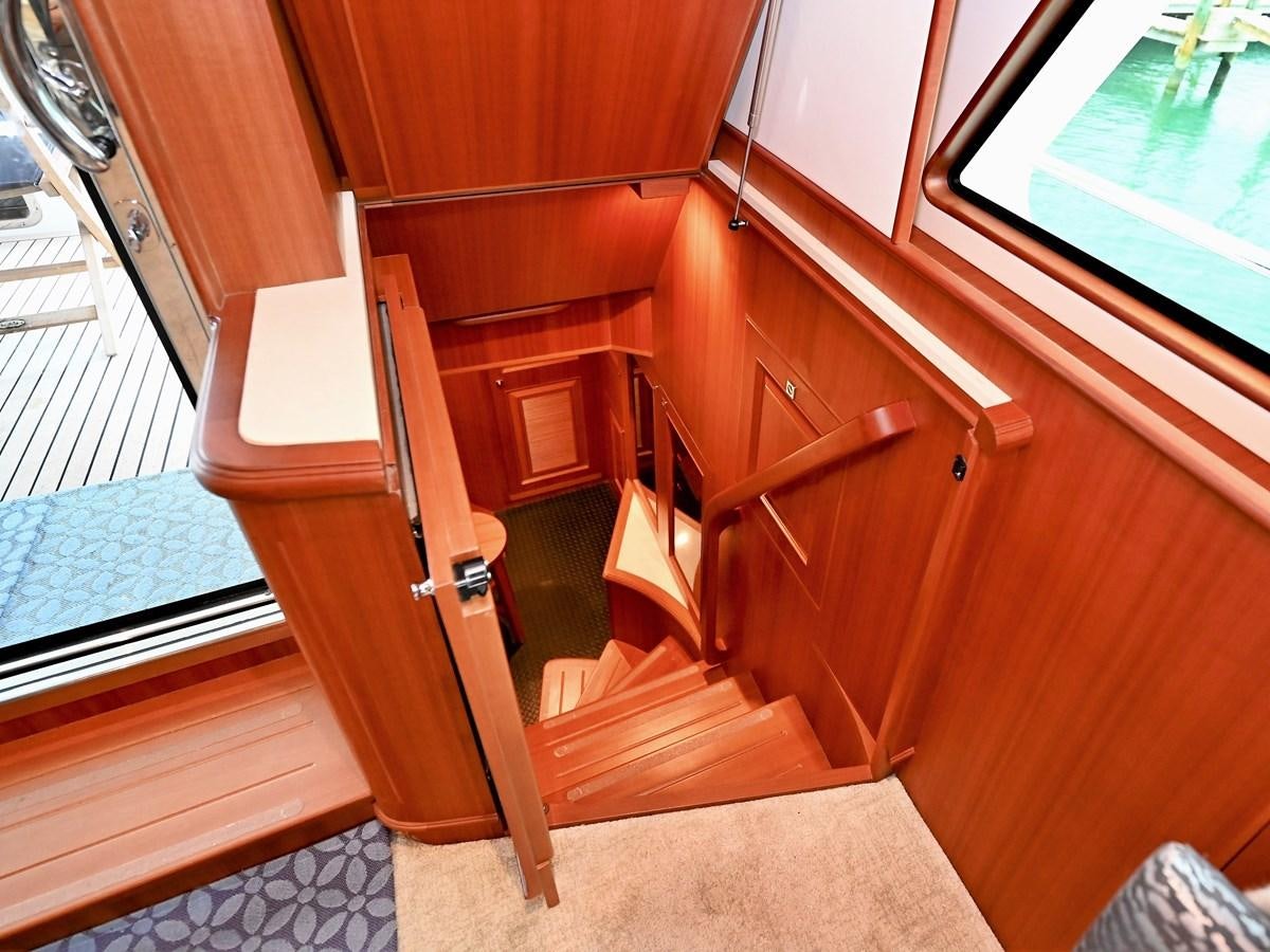 a wooden cabinet and a window aboard KNOT FLYING Yacht for Sale