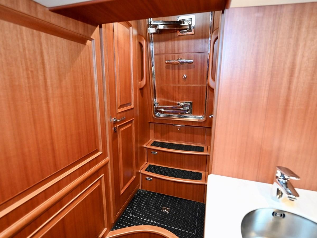a wooden cabinet in a bathroom aboard KNOT FLYING Yacht for Sale