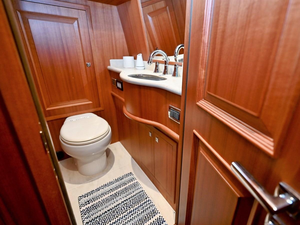 a bathroom with a toilet and sink aboard KNOT FLYING Yacht for Sale