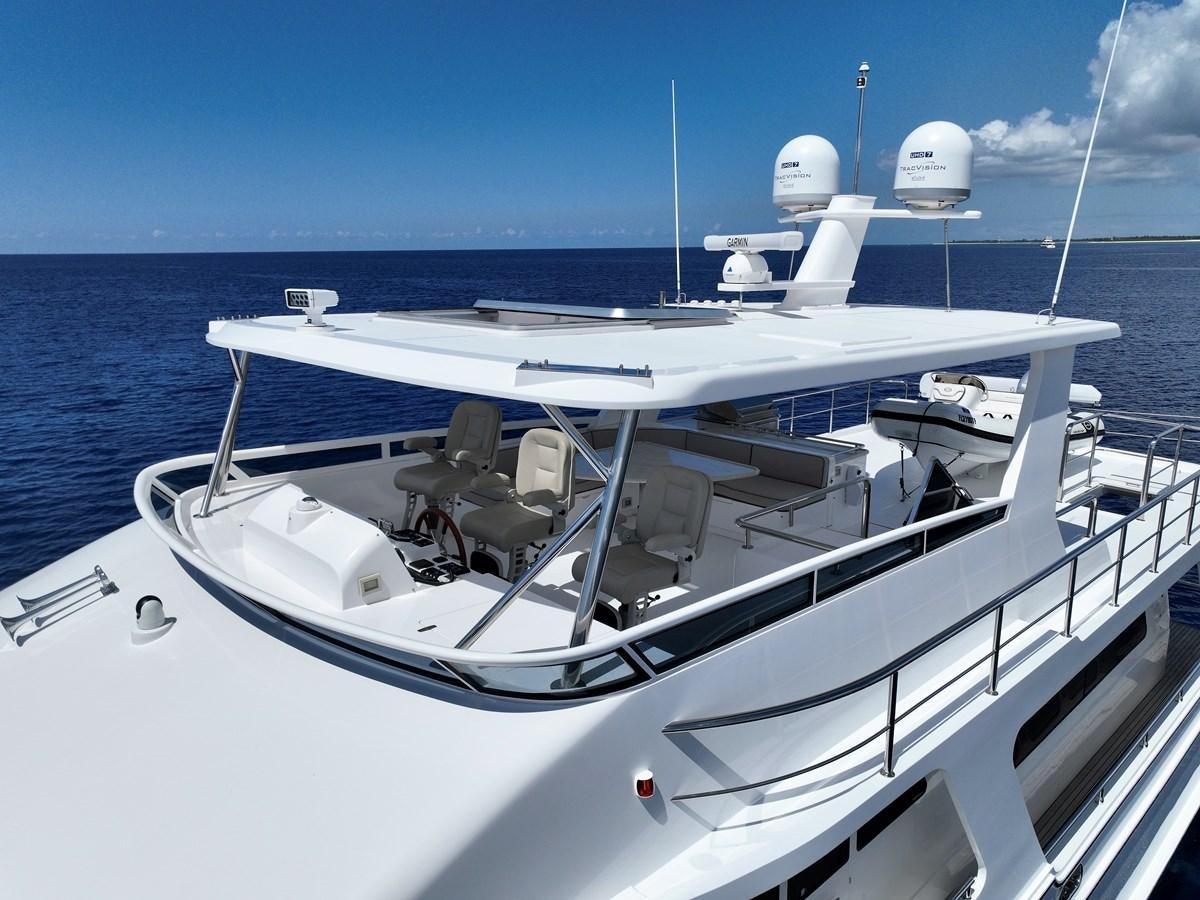 a white boat on the water aboard KNOT FLYING Yacht for Sale