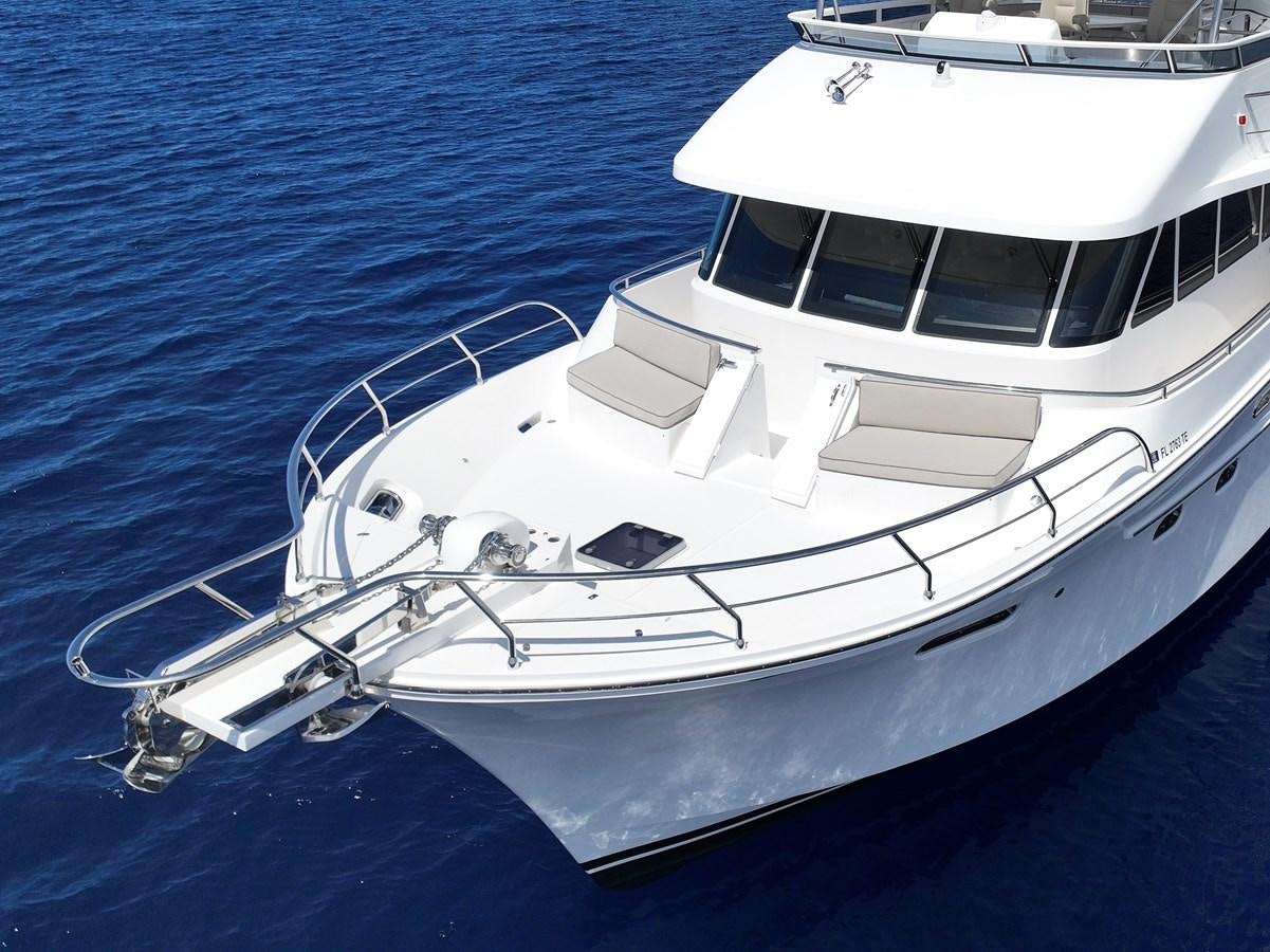 a white yacht in the water aboard KNOT FLYING Yacht for Sale