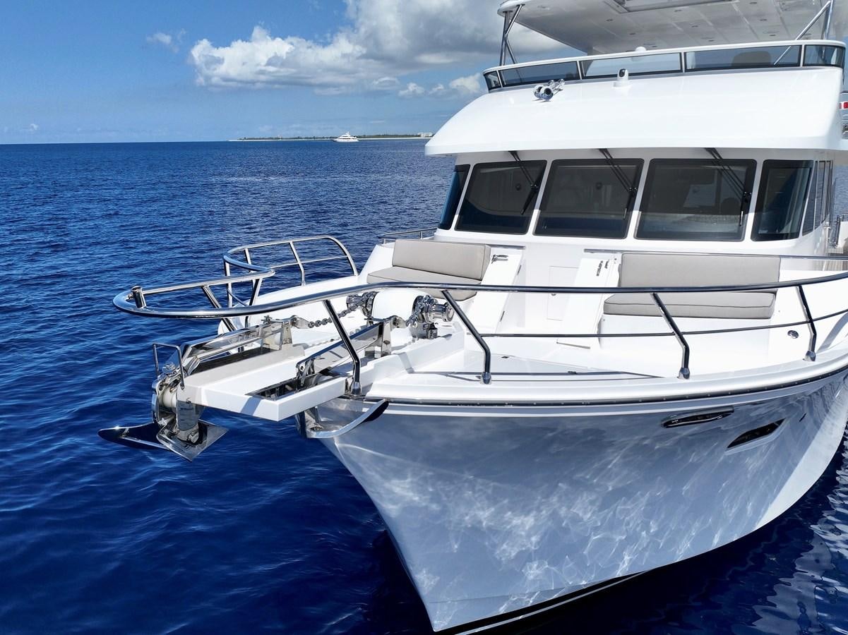 a white boat in the water aboard KNOT FLYING Yacht for Sale