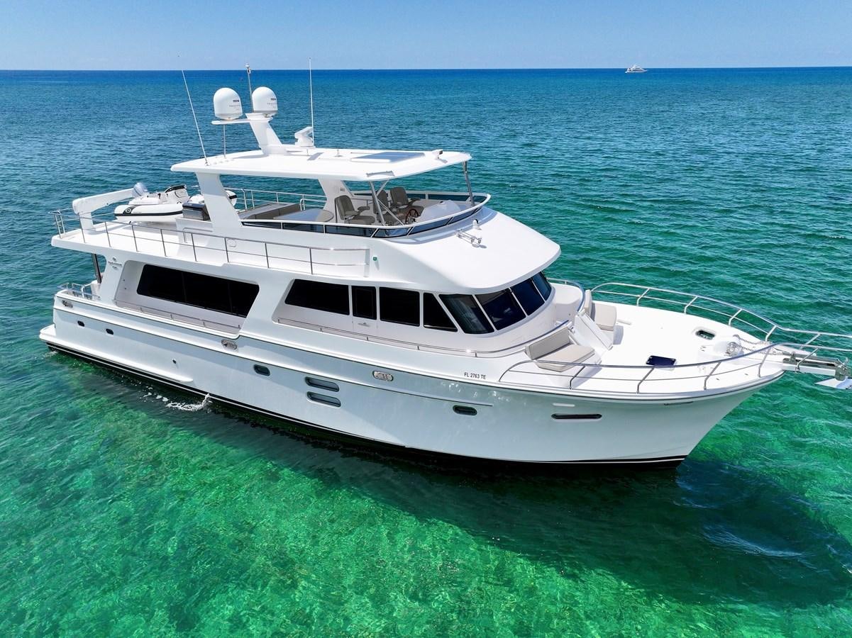 a white yacht in the water aboard KNOT FLYING Yacht for Sale