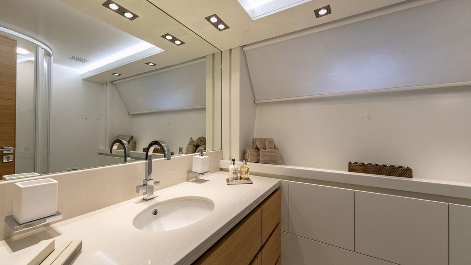 a bathroom with a large mirror aboard SANSARA Yacht for Sale