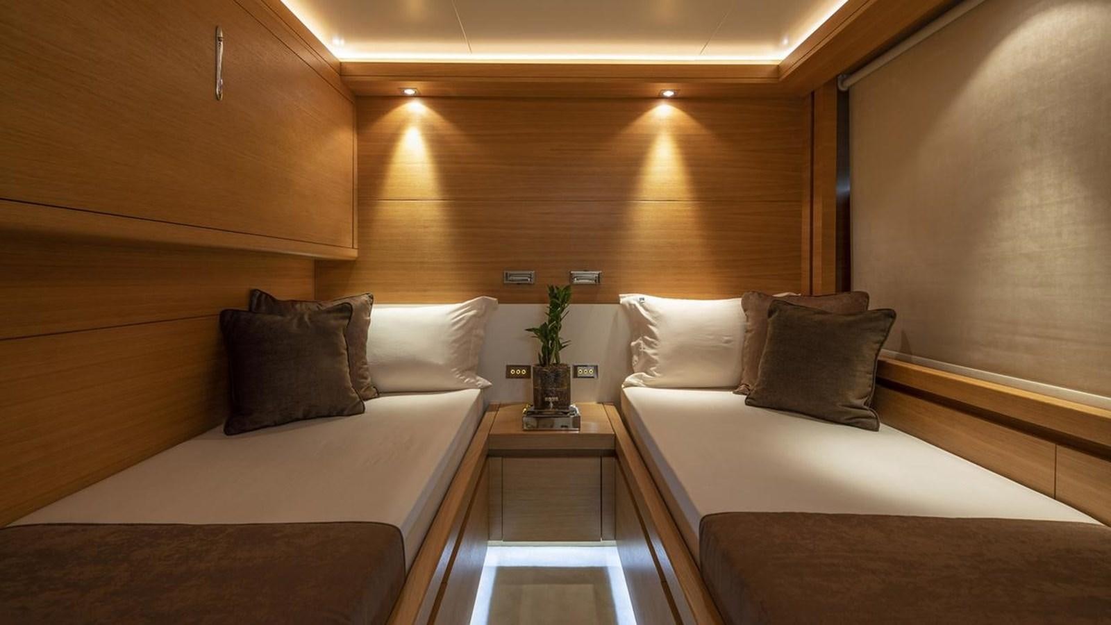 a room with two beds aboard SANSARA Yacht for Sale