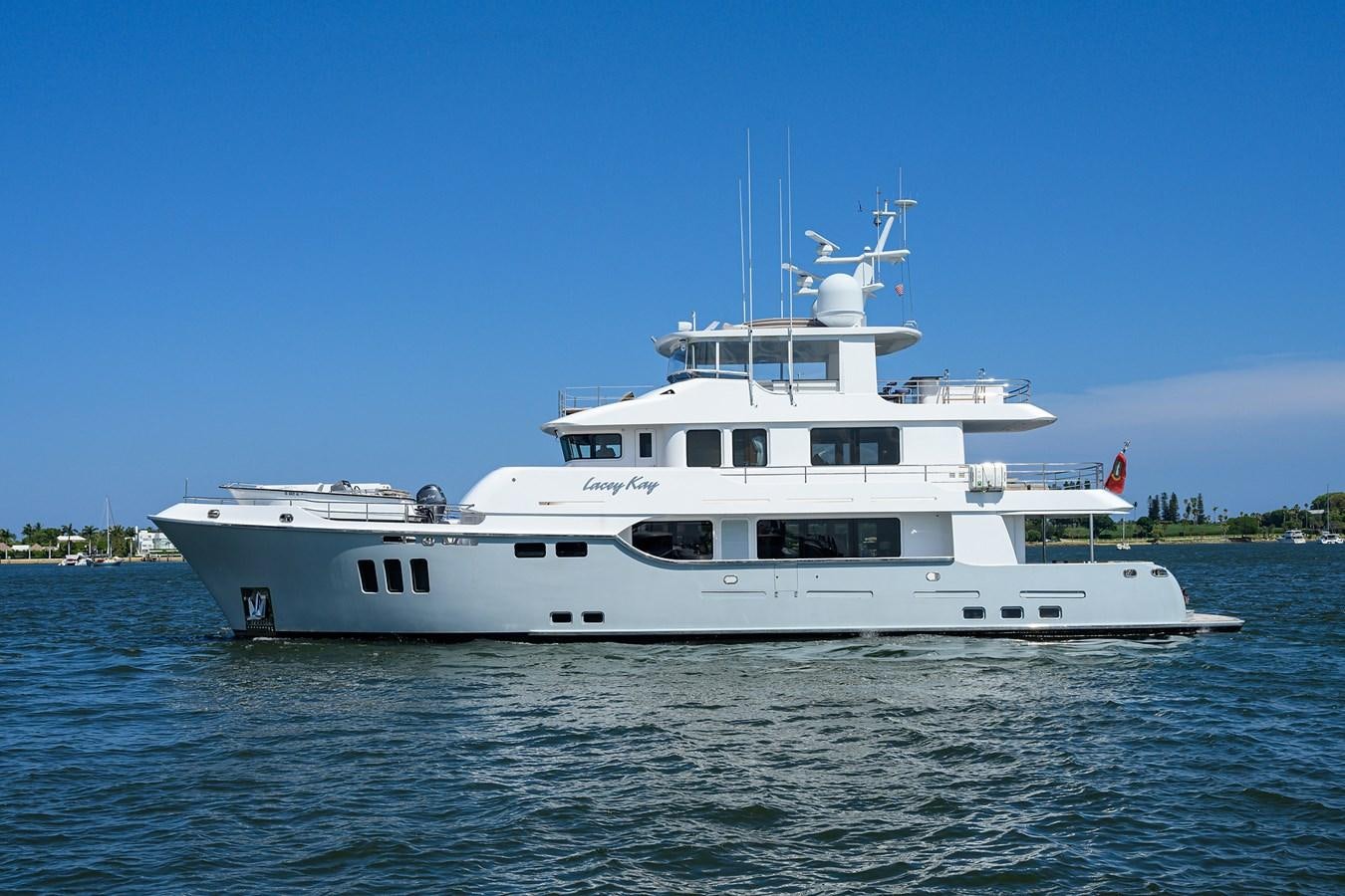 a white boat on the water aboard LACEY KAY Yacht for Sale
