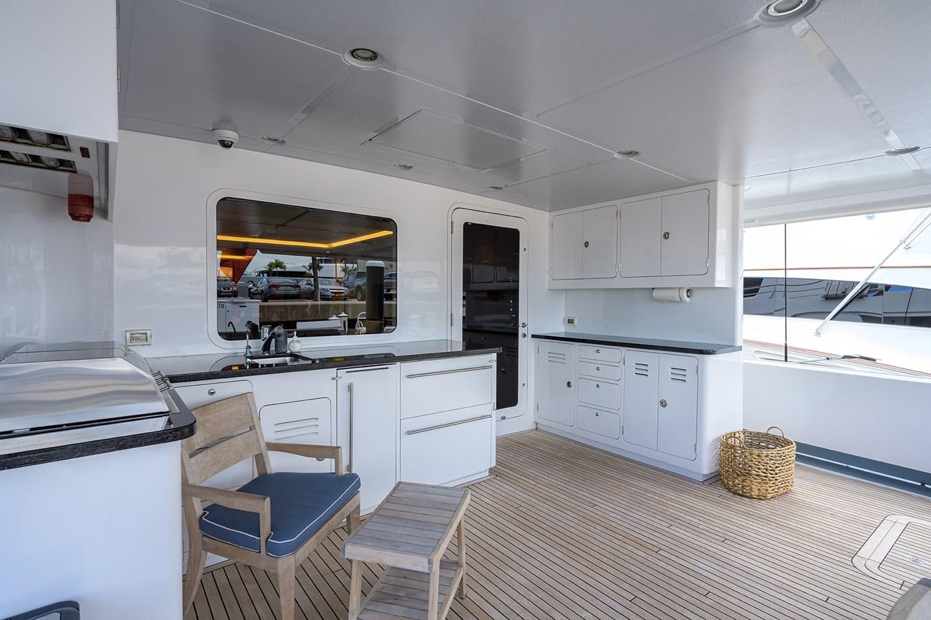 a kitchen with white cabinets aboard LACEY KAY Yacht for Sale