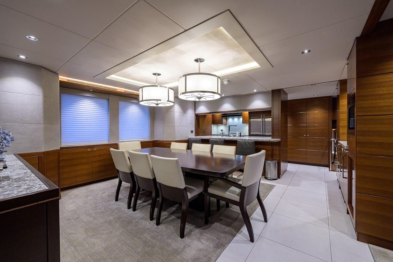 a large kitchen with a dining table aboard LACEY KAY Yacht for Sale