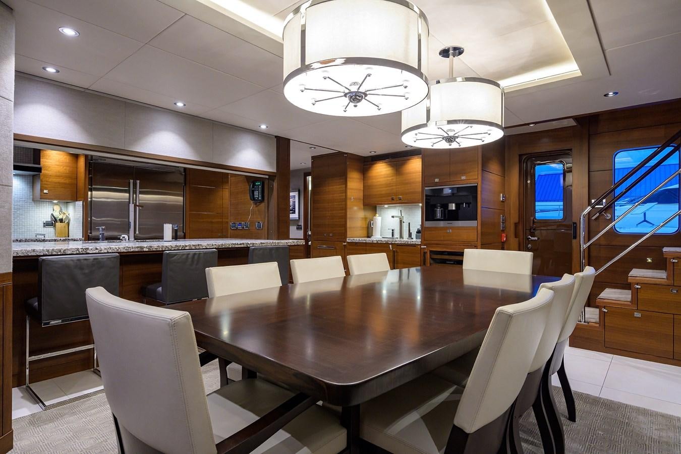 a large room with a table and chairs aboard LACEY KAY Yacht for Sale