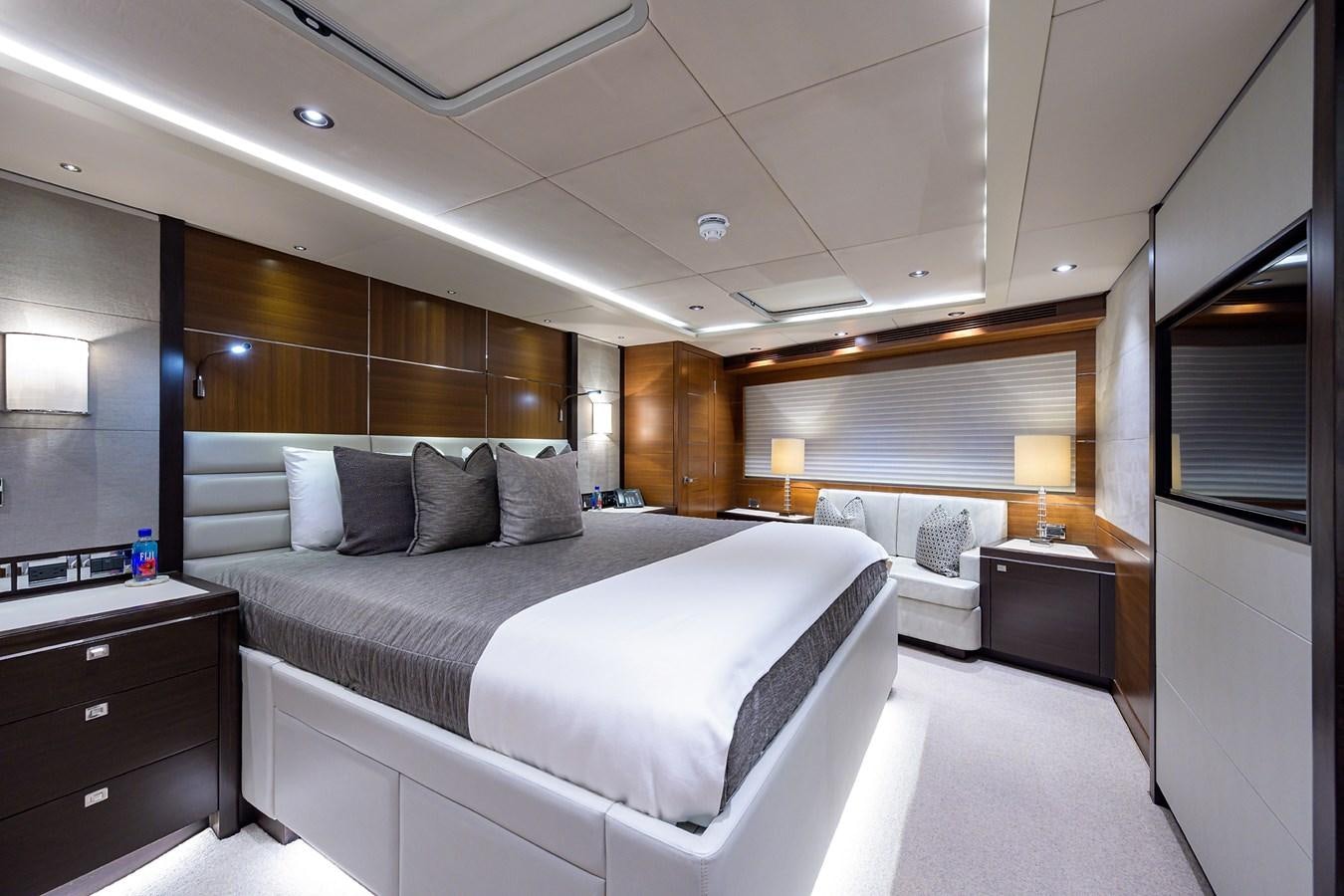 a room with a bed and a couch aboard LACEY KAY Yacht for Sale