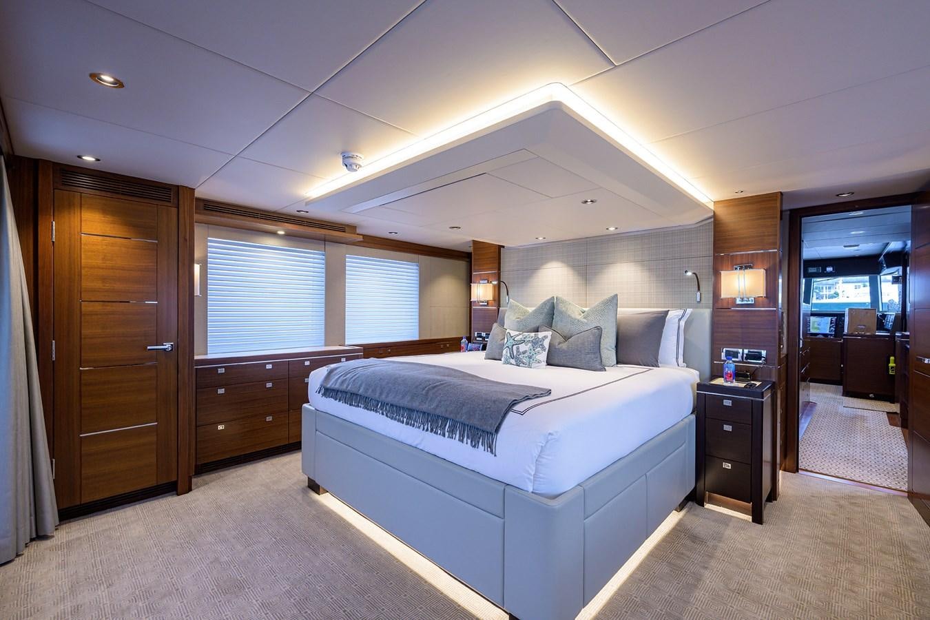 a bedroom with a bed and a closet aboard LACEY KAY Yacht for Sale