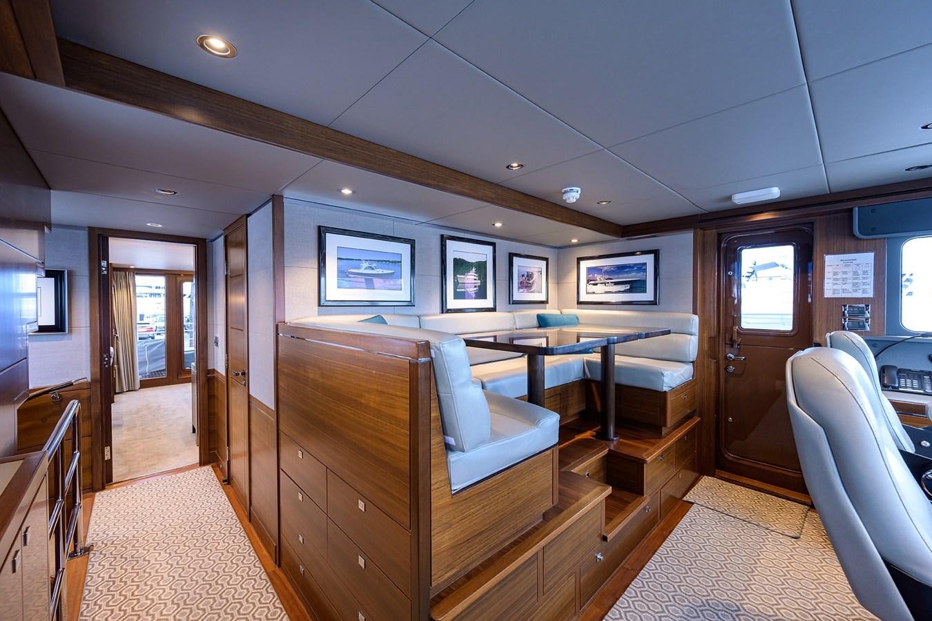 a room with a table and chairs aboard LACEY KAY Yacht for Sale