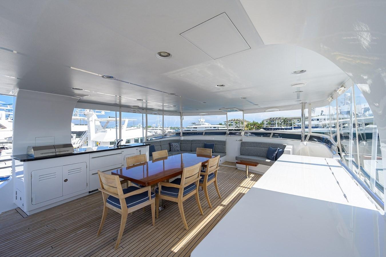 a room with a table and chairs aboard LACEY KAY Yacht for Sale