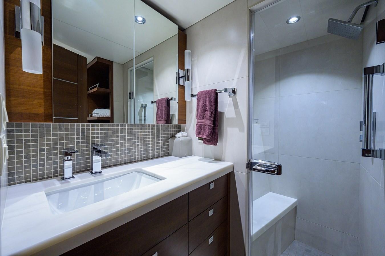 a bathroom with a sink and a mirror aboard LACEY KAY Yacht for Sale