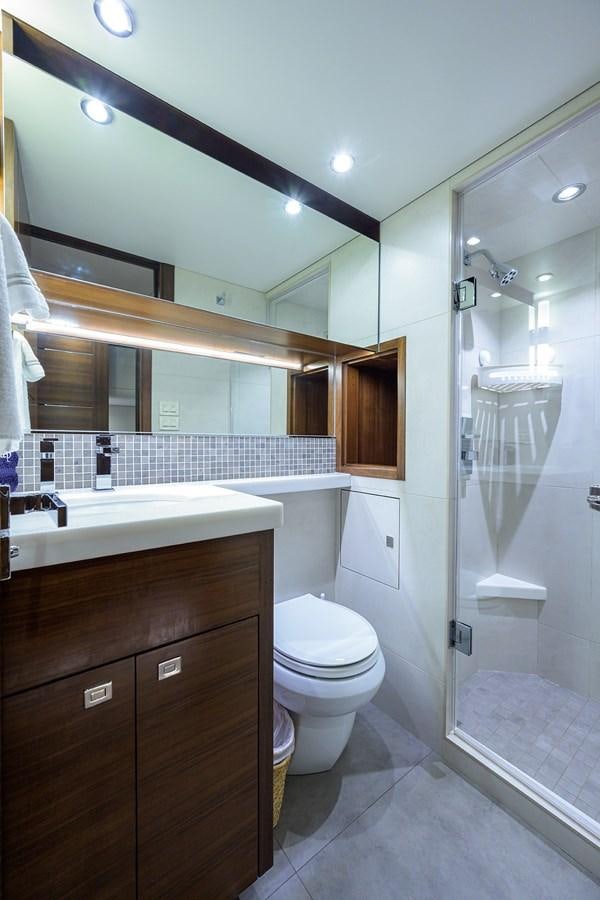 a bathroom with a glass shower aboard LACEY KAY Yacht for Sale