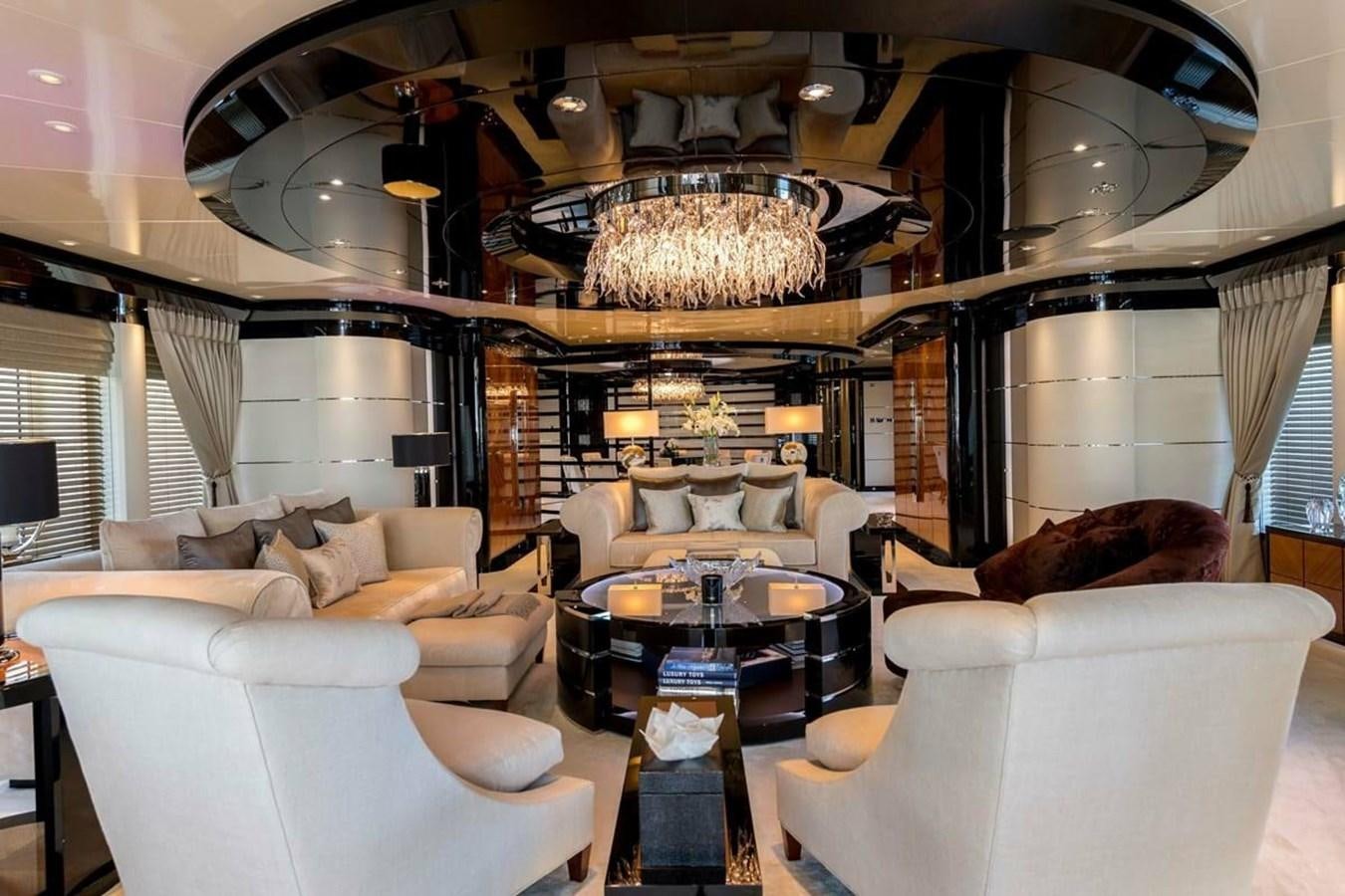 a living room with a chandelier aboard TALISMAN C Yacht for Sale
