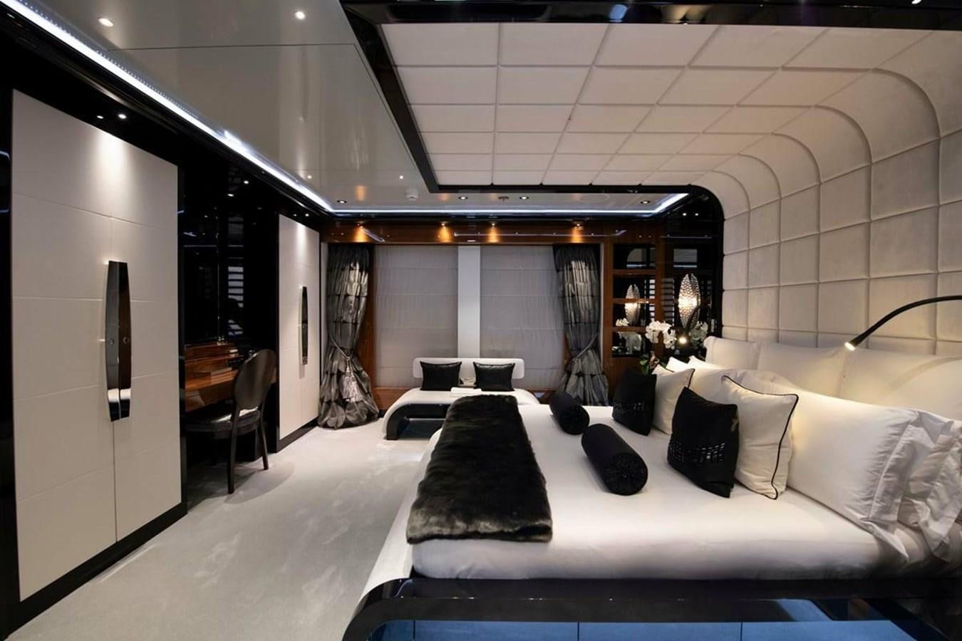 a room with a bed and a desk aboard TALISMAN C Yacht for Sale
