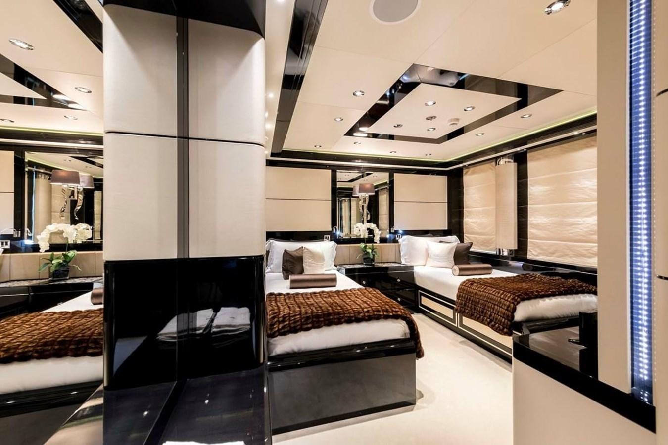 a room with a bed and a mirror aboard TALISMAN C Yacht for Sale