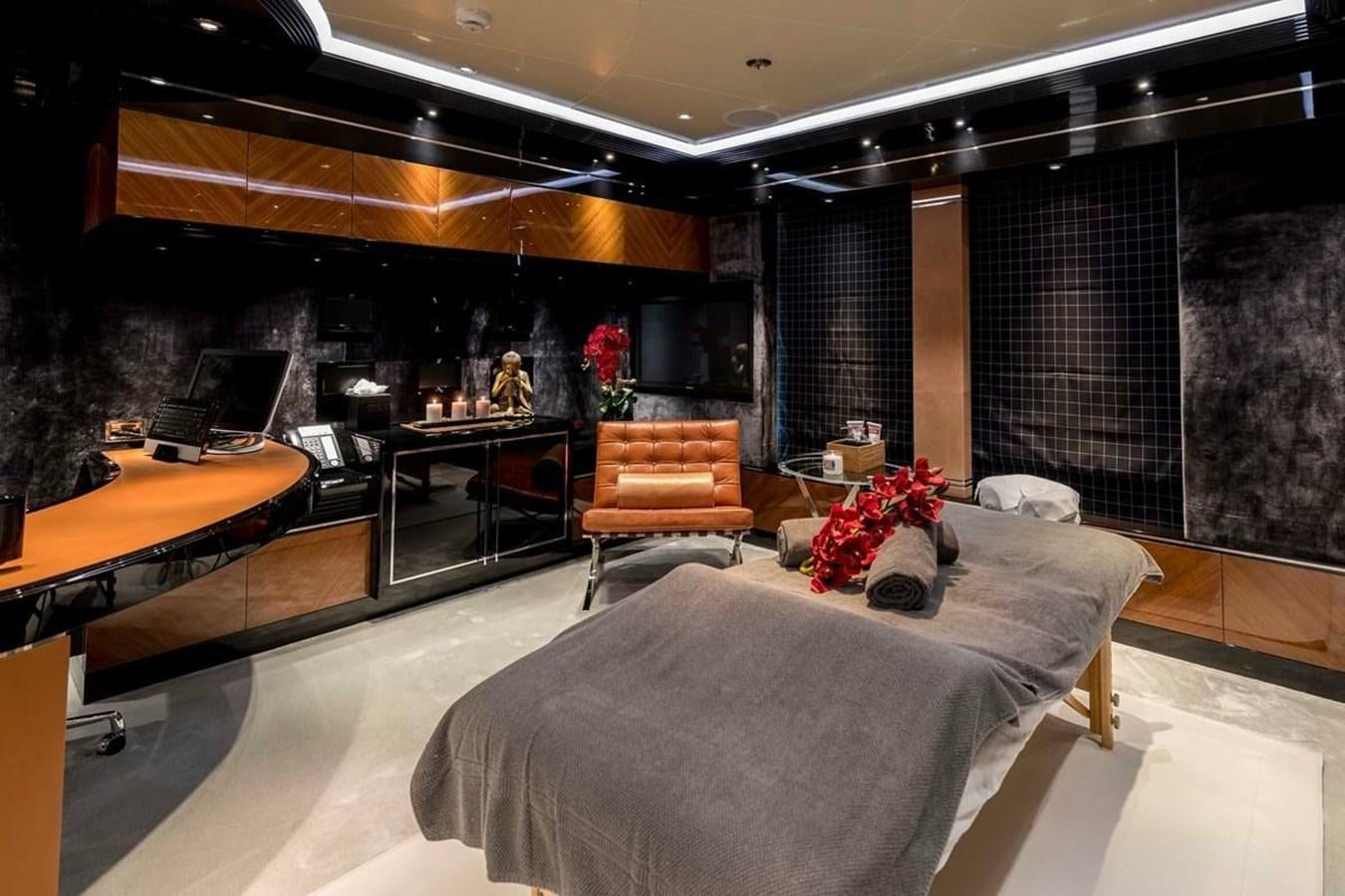 a room with a bed and desk aboard TALISMAN C Yacht for Sale